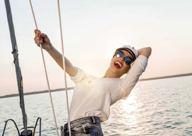 Sexy model on a boat at sunset 000049711344 Large