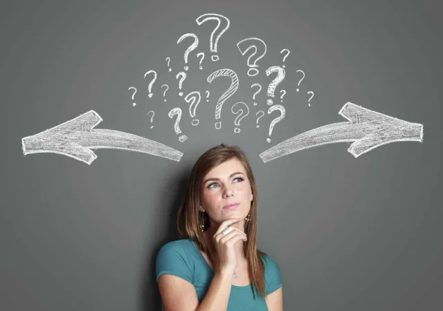 Woman making a decision with arrows and question mark 000053293002 Large 1