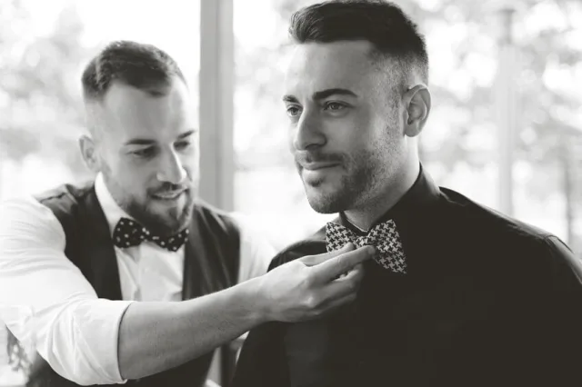 Best man fixing groom s bow tie 000063809937 Small