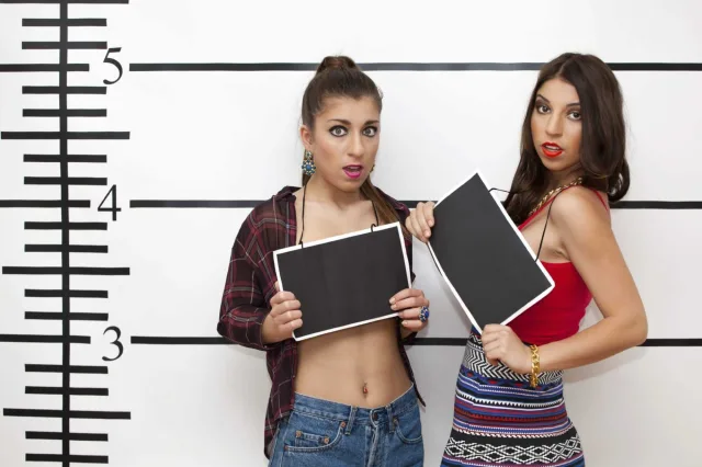 Mugshot of two beautiful young women 000041777206 Large 1